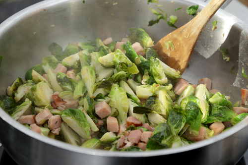 fry your brussel sprouts in a frypan with bacon and onion